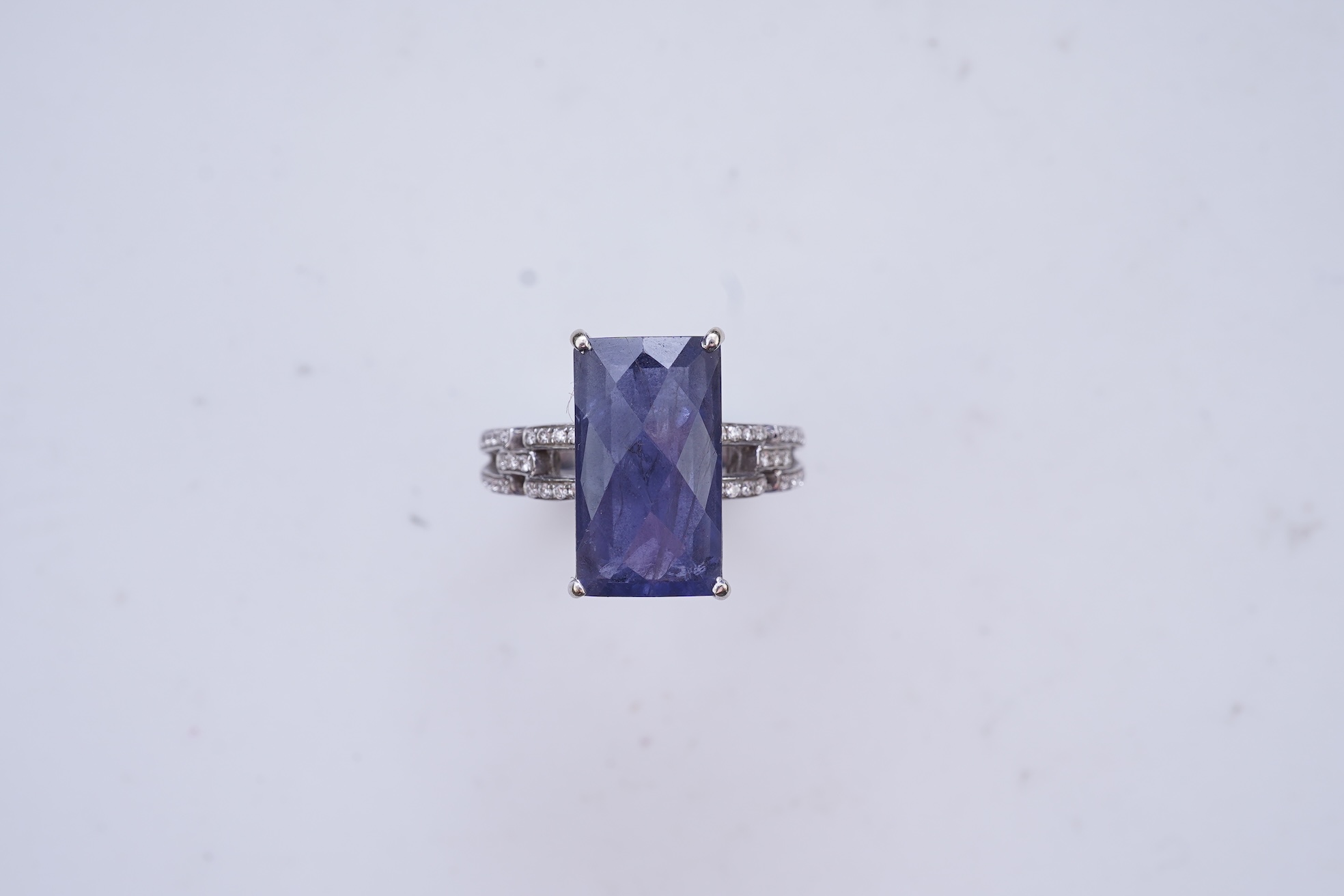 An iolite and diamond ring